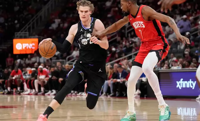 Utah Jazz forward Lauri Markkanen (23) controls the ball against Houston Rockets forward Kevin Durant (7) during the second half of an NBA basketball game, Monday, Feb. 23, 2026, in Houston. (AP Photo/Karen Warren)