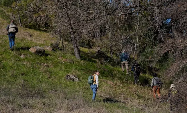 A group of California Lichen Society members and guests take part in a field trip at the University of California, Davis' McLaughlin Reserve in Lower Lake, Calif., Saturday, Jan. 24, 2026. (AP Photo/Jeff Chiu)