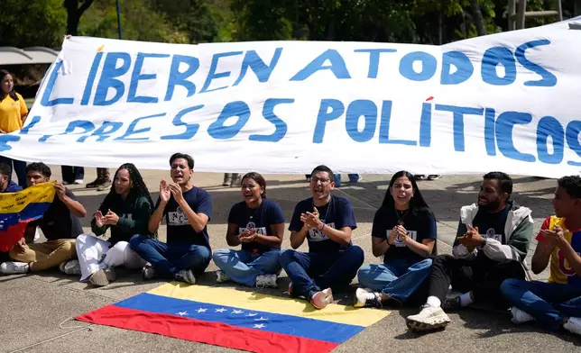 University students rally to demand the release of political prisoners in Caracas, Venezuela, Tuesday, Feb. 3, 2026. (AP Photo/Ariana Cubillos)