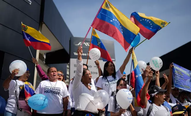 People attend a prayer for freedom of political prisoners, peace and reconciliation, in Caracas, Venezuela, Saturday, Feb. 7, 2026. (AP Photo/Ariana Cubillos)