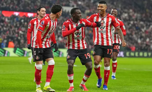 Sunderland's Habib Diarra celebrates with teammates after scoring a goal during a Premier League soccer match against Burnley at the Stadium of Light in Sunderland, Monday, Feb. 2, 2026. (Martin Rickett/PA via AP)