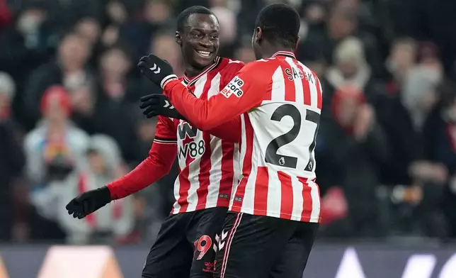 Sunderland's Habib Diarra, left, celebrates scoring his team's second goal against Burnley at the Stadium of Light in Sunderland, Monday, Feb. 2, 2026. (Martin Rickett/PA via AP)