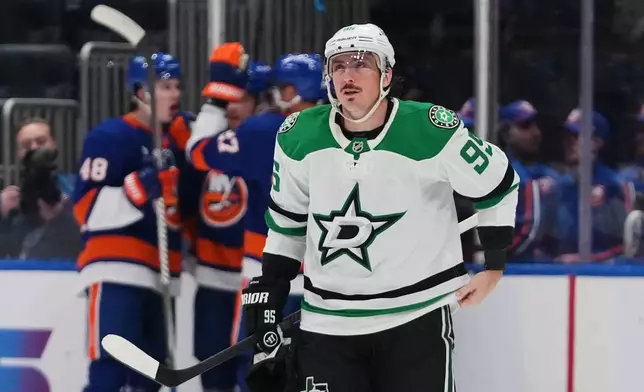 Dallas Stars' Matt Duchene (95) reacts as the New York Islanders celebrate a goal by Bo Horvat during the first period of an NHL hockey game Thursday, March 26, 2026, in Elmont, N.Y. (AP Photo/Frank Franklin II)