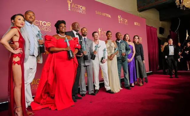 Michael B. Jordan, center, winner of the award for outstanding performance by a male actor, and the cast of "Sinners" pose with award for outstanding performance by a cast in a motion picture during the 32nd Annual Actor Awards on Sunday, March 1, 2026, at the Shrine Auditorium and Expo Hall in Los Angeles. (Photo by Jordan Strauss/Invision/AP)