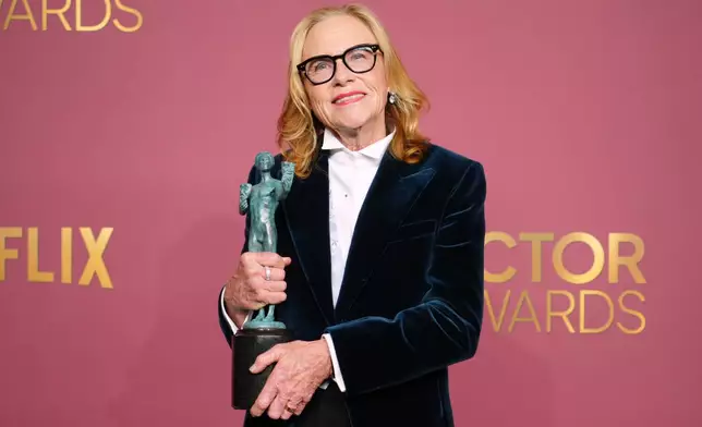 Amy Madigan poses in the press room with the award for outstanding performance by a female actor in a supporting role for "Weapons" during the 32nd Annual Actor Awards on Sunday, March 1, 2026, at the Shrine Auditorium and Expo Hall in Los Angeles. (Photo by Jordan Strauss/Invision/AP)