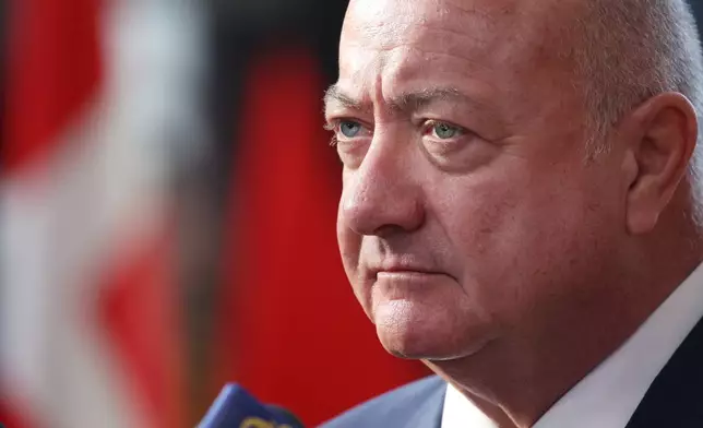 Austria's Chancellor Christian Stocker speaks with the media as he arrives for the EU summit at the European Council building in Brussels, Thursday, March 19, 2026. (AP Photo/Omar Havana)