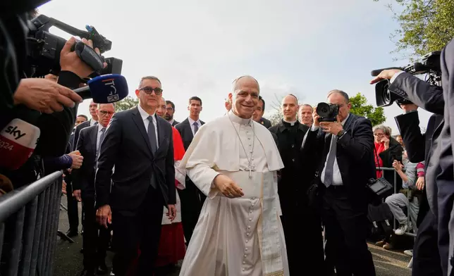 Pope Leo XIV visits the parish complex of the Santa Maria della Presentazione on the outskirts of Rome, Sunday, March 8, 2026. (AP Photo/Gregorio Borgia)