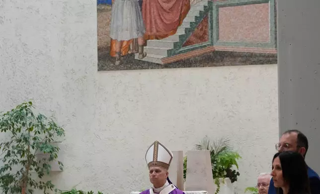 Pope Leo XIV visits the parish complex of Santa Maria della Presentazione on the outskirts of Rome, Sunday, March 8, 2026. (AP Photo/Gregorio Borgia)