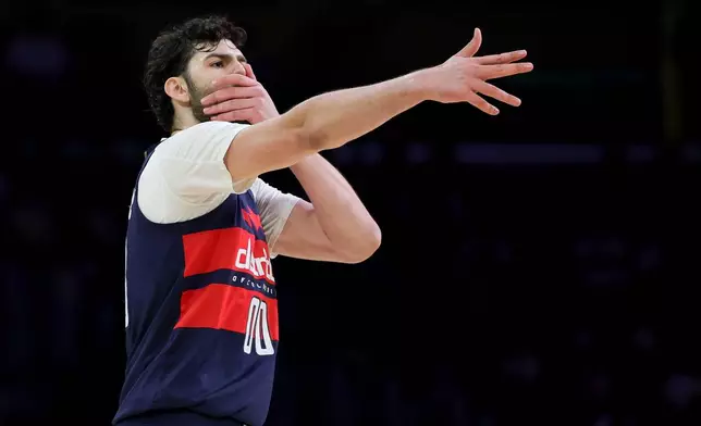 Washington Wizards forward Tristan Vukcevic celebrates after making a three-point basket during the first half of an NBA basketball game against the Los Angeles Lakers Monday, March 30, 2026, in Los Angeles. (AP Photo/Ryan Sun)