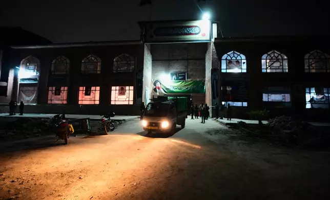 A vehicle loaded with donated goods departs at the conclusion of a relief drive for Iran in Budgam, Indian-controlled Kashmir, Monday, March 23, 2026. (AP Photo/Mukhtar Khan)