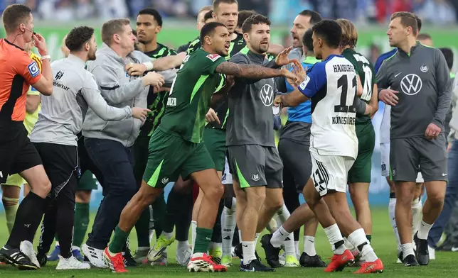 An altercation between Hamburger and Wolfsburg players following their German Bundesliga soccer match in Wolfsburg, Germany, Saturday, March 7, 2026. (Andreas Gora/dpa via AP)