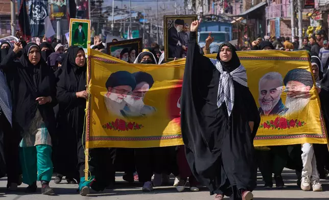 Shia Muslims protesting against the United States and Israel and expressing solidarity with Iran and Palestinians in Gaza, shout slogans during the annual Al-Quds (Jerusalem) Day rally, in Magam, north of Srinagar, Indian controlled Kashmir, Friday, March 13, 2026. (AP Photo/Dar Yasin)