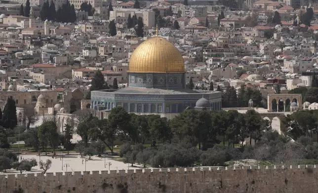 Empty courtyards of the Al-Aqsa compound are seen while Palestinian Muslims offer Friday Ramadan prayers take place in Jerusalem as the Old City remains closed to visitors under nationwide Home Front Command restrictions banning large gatherings amid the war with Iran, Friday, March 13, 2026. (AP Photo/Mahmoud Illean)