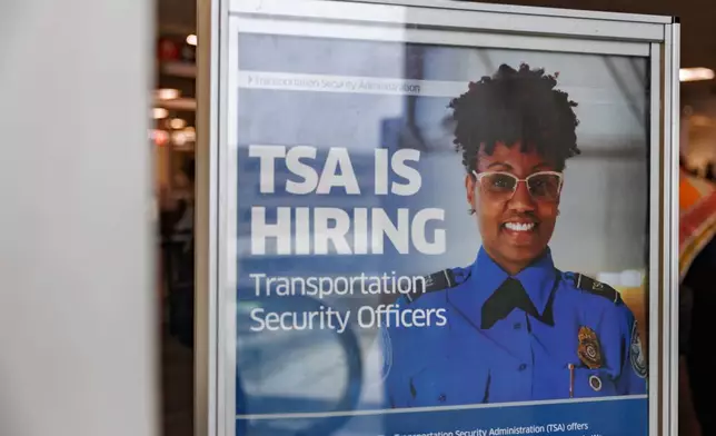 Signage reading "TSA is Hiring" at Philadelphia International Airport, Monday, March 23, 2026, in Philadelphia. (AP Photo/Hannah Beier)