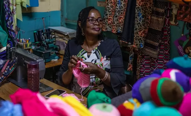 Mary Mwangi, 52, a breast cancer survivor, knits breast prostheses at her shop in Thika, Kiambu County, Kenya, Friday, Jan. 30, 2026. (AP Photo/Samson Otieno)