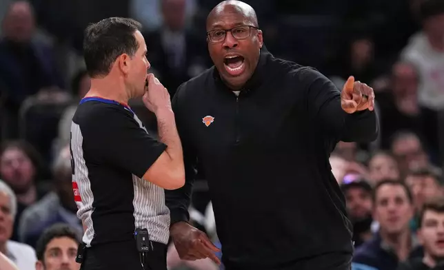 New York Knicks head coach Mike Brown argues a call with an official during the first half of an NBA basketball game against the Oklahoma City Thunder Wednesday, March 4, 2026, in New York. (AP Photo/Frank Franklin II)