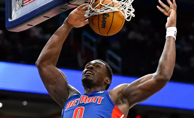 Detroit Pistons center Jalen Duren (0) dunks the ball during the second half of an NBA basketball game against the Washington Wizards, Tuesday, March 17, 2026, in Washington. (AP Photo/John McDonnell)