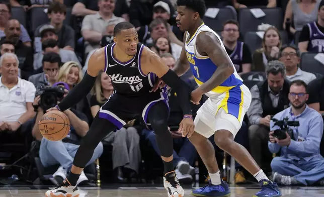 Sacramento Kings guard Russell Westbrook (18) is guarded by Indiana Pacers guard Kam Jones (7) during the first half of an NBA basketball game Tuesday, March 10, 2026, in Sacramento, Calif. (AP Photo/Scott Marshall)