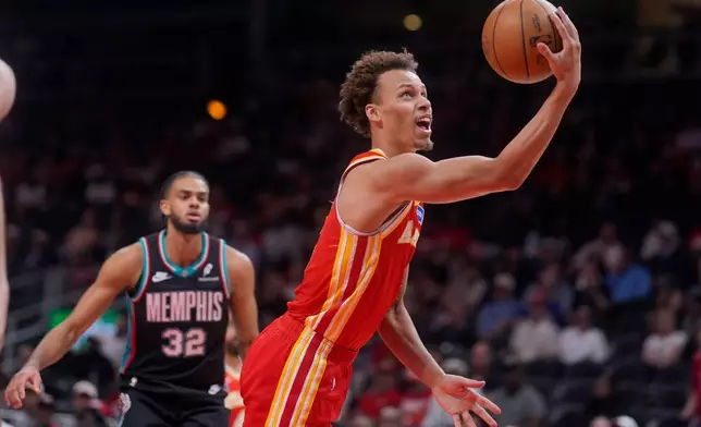 Atlanta Hawks guard Dyson Daniels (5) shoots against the Memphis Grizzlies during the first half of an NBA basketball game, Monday, March 23, 2026, in Atlanta. (AP Photo/Mike Stewart)