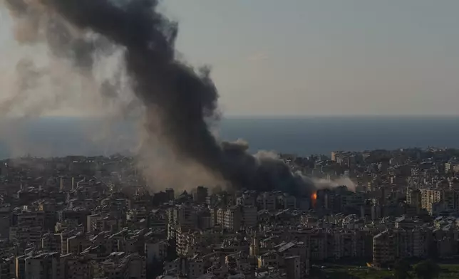 Flames and smoke rise from Israeli airstrikes on Dahiyeh, a southern suburb of Beirut, Lebanon, Monday, March 2, 2026. (AP Photo/Hassan Ammar)