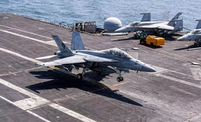 This image provided by U.S. Central Command shows a F/A-18E Super Hornet makes an arrested landing on the USS Abraham Lincoln (CVN 72) after a mission in support of Operation Epic Fury, on Saturday, Feb. 28, 2026. (U.S. Navy via AP)