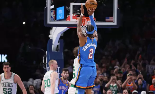 Oklahoma City Thunder guard Shai Gilgeous-Alexander (2) shoots a 2-point basket to break Wilt Chamberlain's 20-point streak record during the second half of an NBA basketball game against the Boston Celtics, Thursday, March 12, 2026, in Oklahoma City. (AP Photo/Nate Billings)