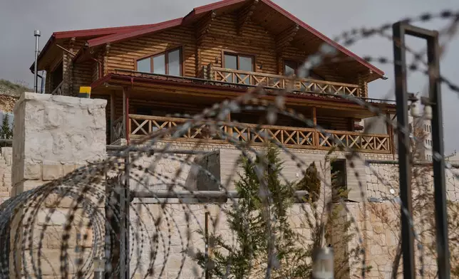The "Wood Villa" in the eastern city of Zahleh, Lebanon, Tuesday, Feb. 17, 2026, that was allegedly used as a base by the kidnappers who lured retired Lebanese officer Ahmed Shukr to a nearby area from where they whisked him away. (AP Photo/Bilal Hussein)