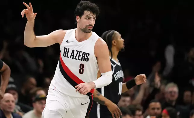 Portland Trail Blazers' Deni Avdija (8) gestures after making a three-point shot during the first half of an NBA basketball game against the Brooklyn Nets Monday, March 16, 2026, in New York. (AP Photo/Frank Franklin II)