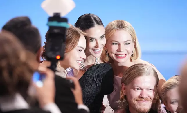 Emma Stone, from left, Demi Moore, Michelle Williams, and Jesse Plemons appear in the audience during the 32nd Annual Actor Awards on Sunday, March 1, 2026, at the Shrine Auditorium and Expo Hall in Los Angeles. (AP Photo/Chris Pizzello)