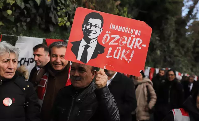 Supporters gather outside Silivri prison, where Istanbul jailed Mayor Ekrem Imamoglu stands trial accused of widespread corruption, west of Istanbul, Turkey, Monday, March 9, 2026. The poster reads in Turkish: "Ekrem Imamoglu freedom". (AP Photo/Dilara Acikgoz)
