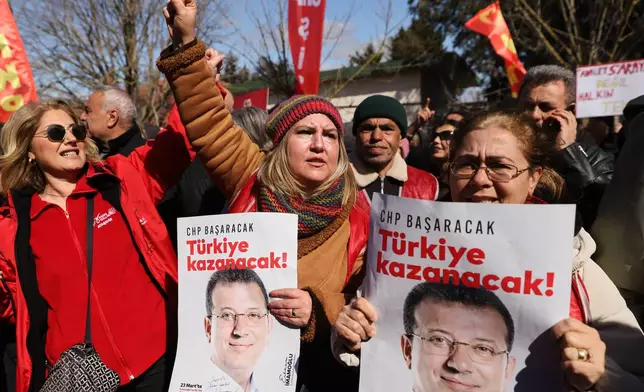 Supporters shout slogans outside Silivri prison, where Istanbul jailed Mayor Ekrem Imamoglu stands trial accused of widespread corruption, west of Istanbul, Turkey, Monday, March 9, 2026. Posters read in Turkish: "Türkiye will win!". (AP Photo/Dilara Acikgoz)