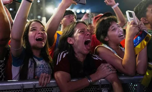 Venezuela fans celebrate their country's win against the United States in the championship match of the World Baseball Classic a day prior, in Caracas, Venezuela, Wednesday, March 18, 2026. (AP Photo/Ariana Cubillos)