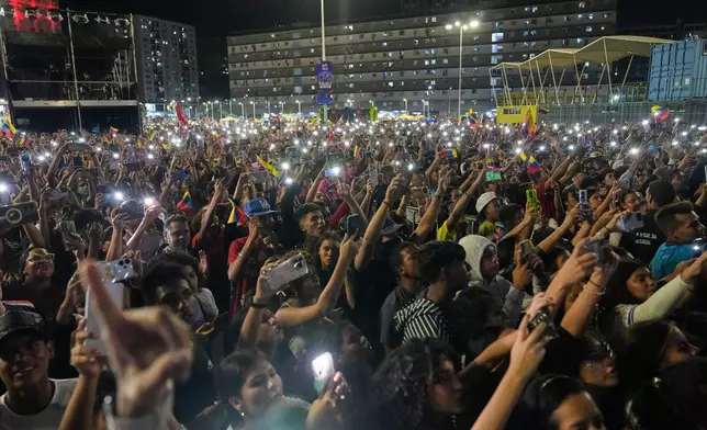 Venezuela fans celebrate their country's win against the United States in the championship match of the World Baseball Classic a day prior, in Caracas, Venezuela, Wednesday, March 18, 2026. (AP Photo/Ariana Cubillos)