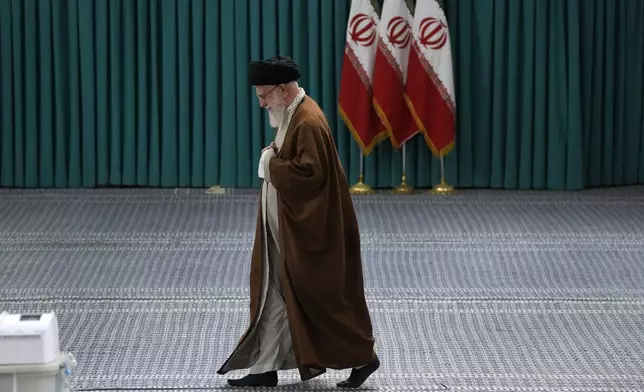 FILE - Iranian Supreme Leader Ayatollah Ali Khamenei arrives to vote for the parliamentary runoff elections, in Tehran, Iran, May 10, 2024. (AP Photo/Vahid Salemi, File)