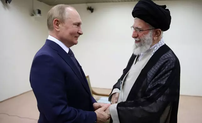 FILE - In this picture released by the official website of the office of the Iranian supreme leader, Supreme Leader Ayatollah Ali Khamenei, right, and Russian President Vladimir Putin greet each other during their meeting in Tehran, Iran, July 19, 2022. (Office of the Iranian Supreme Leader via AP, File)