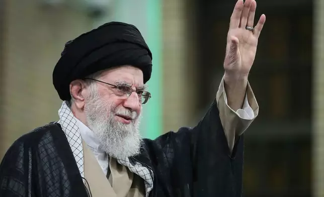 FILE - In this photo released by the official website of the office of the Iranian supreme leader, Supreme Leader Ayatollah Ali Khamenei waves to the crowd during his meeting with a large group of laborers in Tehran, Iran, May 10, 2025. (Office of the Iranian Supreme Leader via AP, File)