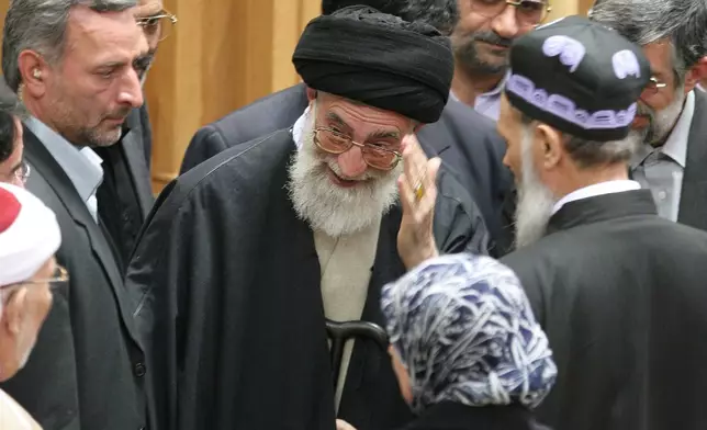 FILE - After delivering his speech, Iran's supreme leader Ayatollah Ali Khamenei waves as he leaves a conference discussing support for the Palestinians in Tehran, Iran, April 14, 2006. (AP Photo/Vahid Salemi, File)