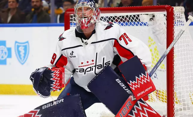 Washington Capitals goaltender Charlie Lindgren watches the puck during the first period of an NHL hockey game against the Buffalo Sabres, Thursday, March 12, 2026, in Buffalo, N.Y. (AP Photo/Jeffrey T. Barnes)