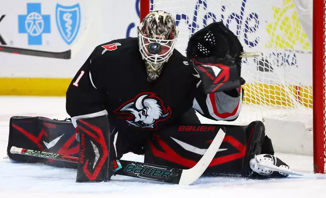 Buffalo Sabres goaltender Ukko-Pekka Luukkonen slides across the crease to make a save during the second period of an NHL hockey game against the Washington Capitals, Thursday, March 12, 2026, in Buffalo, N.Y. (AP Photo/Jeffrey T. Barnes)