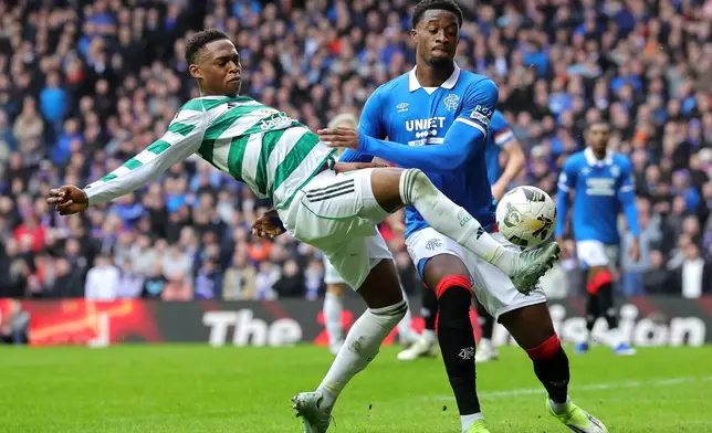 Ranger's Emmanuel Fernandez, right, and Celtic's Chukwubuike Adamu, left, challenge for the ball during the Scottish Premiership match between Glasgow Rangers and Celtic Glasgow in Glasgow, Scotland, Sunday, March 1, 2026. (Steve Welsh/PA via AP)