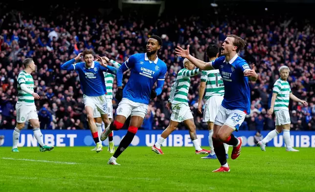 Ranger's Youssef Chermiti, center, celebrates after scoring the opening goal during the Scottish Premiership match between Glasgow Rangers and Celtic Glasgow in Glasgow, Scotland, Sunday, March 1, 2026. ( Jane Barlow/PA via AP)