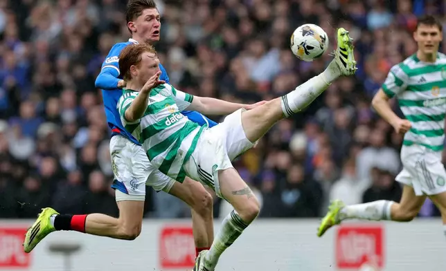 Ranger's Ryan Naderi, left, and Celtic's Liam Scales, right, challenge for the ball during the Scotish Premiership match between Glasgow Rangers and Celtic Glasgow in Glasgow, Scotland, Sunday, March 1, 2026. (Steve Welsh/PA via AP)
