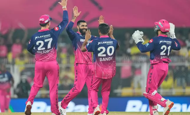 Rajasthan Royals' Ravindra Jadeja, second left, celebrates with teammates the wicket of Chennai Super Kings' Shivam Dube during the Indian Premier League cricket match between Chennai Super Kings and Rajasthan Royals in Guwahati, India, Monday, March 30, 2026. (AP Photo/Anupam Nath)