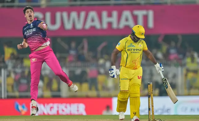 Rajasthan Royals's Nandre Burger, left, celebrates the wicket of Chennai Super Kings' Sanju Samson during the Indian Premier League cricket match between Chennai Super Kings and Rajasthan Royals in Guwahati, India, Monday, March 30, 2026. (AP Photo/Anupam Nath)