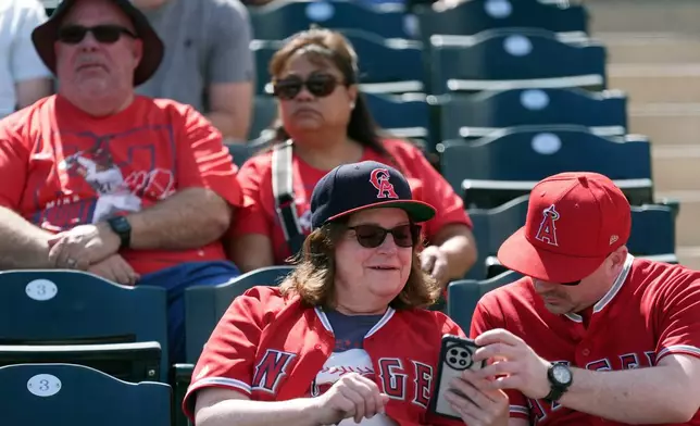 Los Angeles Angels fans wait in the stands prior to a spring training baseball game against the San Diego Padres Tuesday, March 10, 2026, in Tempe, Ariz. (AP Photo/Ross D. Franklin)