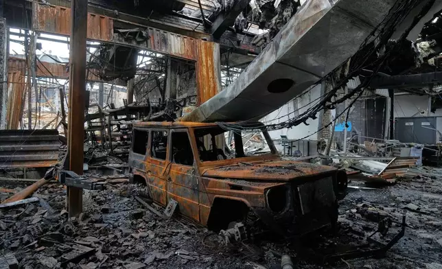 A view of the damages at Hypercar, an auto service center, which according to the company's officials were caused by strikes on March 1, in Tehran, Iran, Saturday, March 28, 2026. (AP Photo/Vahid Salemi)