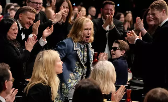 FILE - Amy Madigan, center, reacts to winning the award for best supporting actress for "Weapons" during the 31st Annual Critics Choice Awards in Santa Monica, Calif., on an. 4, 2026. (AP Photo/Chris Pizzello, File)