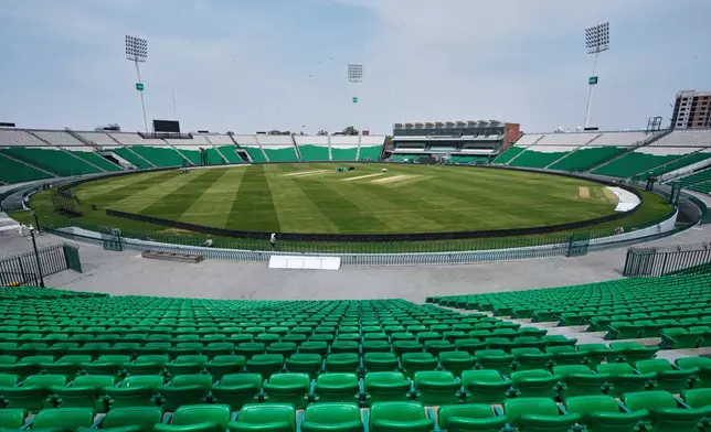 Groundsmen work at the at the Gaddafi Stadium in preparations for upcoming Pakistan's premier domestic T20 the Pakistan Super League, which will take place in empty stadiums due to the recent spike in oil prices, in Lahore, Pakistan, Tuesday, March 24, 2026. (AP Photo/K.M. Chaudary)