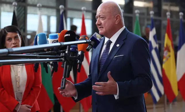 Austria's Chancellor Christian Stocker speaks with the media as he arrives for the EU summit at the European Council building in Brussels, Thursday, March 19, 2026. (AP Photo/Omar Havana)