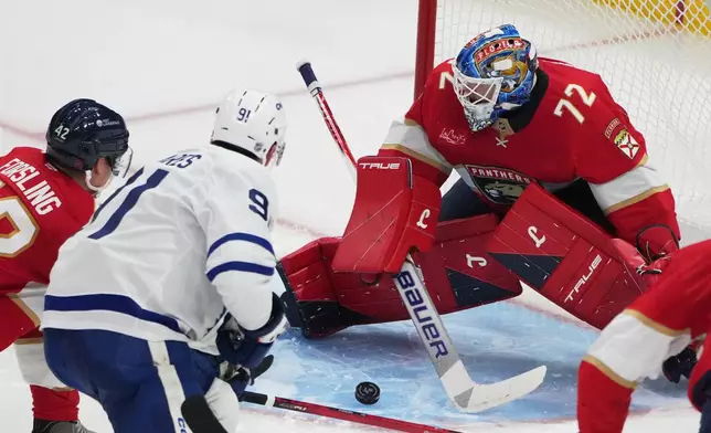 Toronto Maple Leafs center John Tavares (91) scores a goal against Florida Panthers goaltender Sergei Bobrovsky (72) during the third period of an NHL hockey game, Thursday, Feb. 26, 2026, in Sunrise, Fla. (AP Photo/Lynne Sladky)